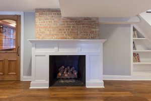 white fireplace surround shaker exposed brick hinsdale illinois wheatland cabinets