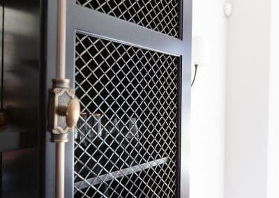 Family Room Dry Bar Cabinetry in Elmhurst, Illinois crimp wire grille cremone tricorn black