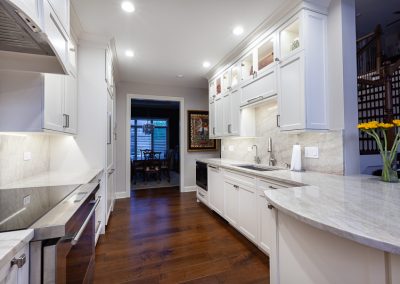 Custom White Custom Cabinets in Naperville, Illinois taj mahal quartzite, frameless full overlay, double stacked uppers