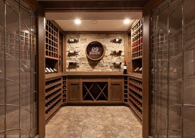 Home Wine Cellar in Naperville, Illinois glass doors inset cabinetry brown stain wine storage