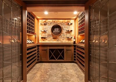 Home Wine Cellar in Naperville, Illinois glass doors inset cabinetry brown stain wine storage