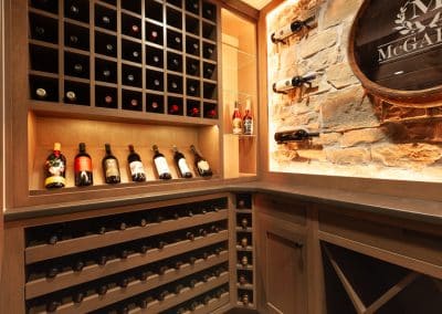 Home Wine Cellar in Naperville, Illinois glass doors inset cabinetry brown stain wine storage