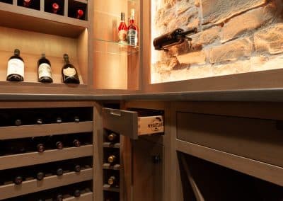 Home Wine Cellar in Naperville, Illinois glass doors inset cabinetry brown stain wine storage